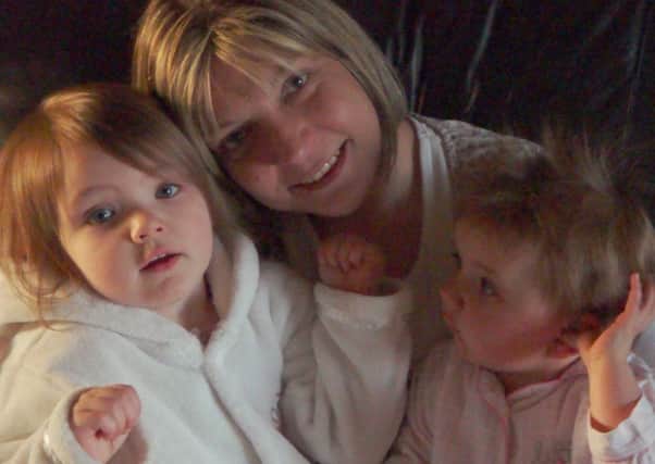 Avril McLeod with her daughters Sarah and Emily.