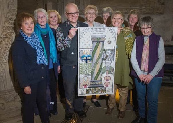 Tapestry designer Andrew Crummy at Rosslyn Chapel on Monday with stitchers, from left, Anne Beedie, Jean Lindsay, Dorie Wilkie, Margaret Humphries, Jinty Murray, Fiona Macintosh, Phillipa Peat and Barbara Stokes.