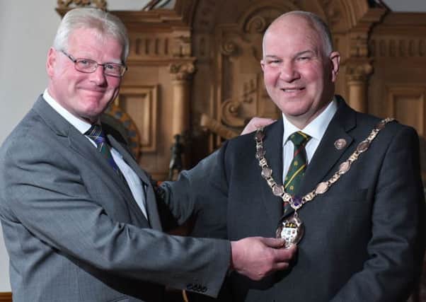 Stuart Marshall handing over the Hawick provost's chain of office to Watson McAteer.