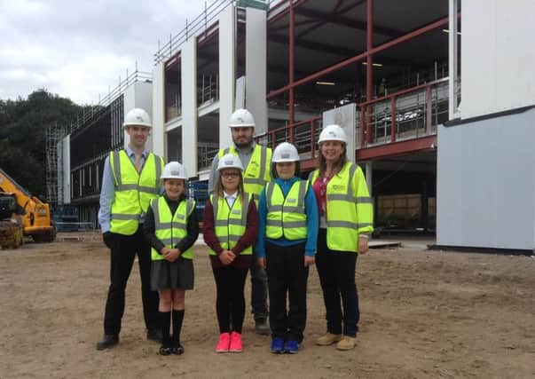 Langlee Primary School pupils being given a tour of the new school site.