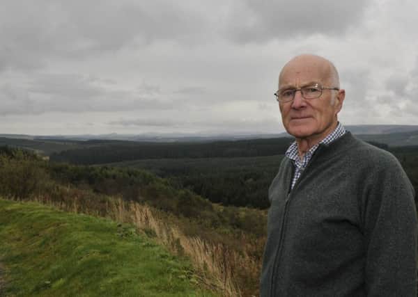Retired Anglican priest Andrew Warburton looking over towards the proposed site for a wind farm at Highlee Hill.