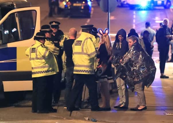 Police outside the Manchester Arena last night.
