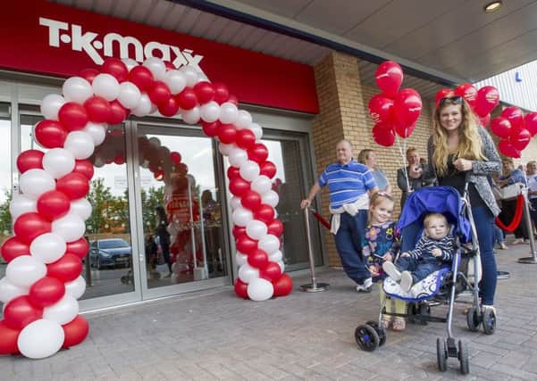 Bodene Hynes from Kelso with her children Skye and Martin are amongst the first to visit the new store.