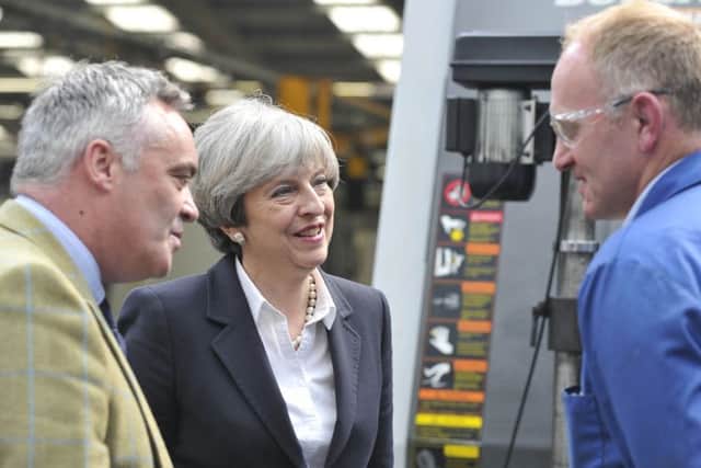 Prime Minister Theresa May visited Abbey Tool and Gauge in Kelso today, pictured speaking to Adam Roxburgh, right, and Alistair Reid.