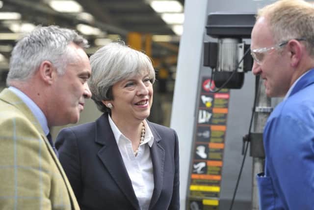 Prime Minister Theresa May visiting Abbey Gauge and Tools in Kelso today. Pictured here speaking to Adam Roxburgh.