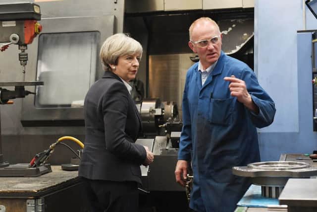 Prime Minister Theresa May visiting Abbey Gauge and Tools in Kelso today. Pictured here with Adam Roxburgh.