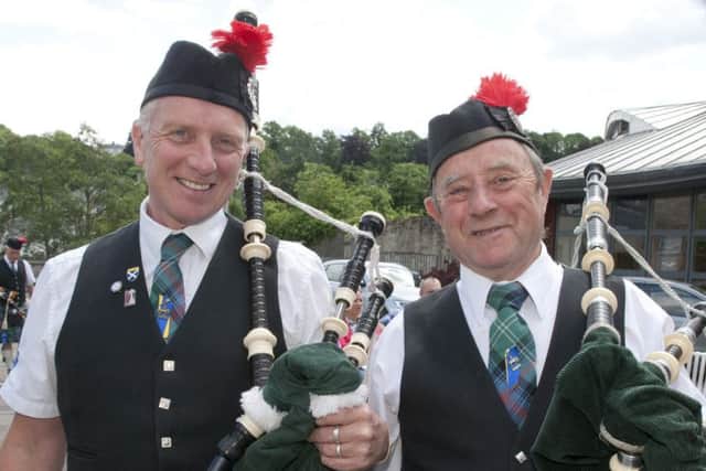 Pipers Derek and Bill Campbell from the Hawick Scout Pipe Band.