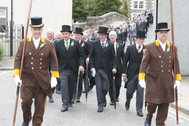 Hawick Cornet Ali George leads the parade to St Mary's Church on Kirking Sunday.