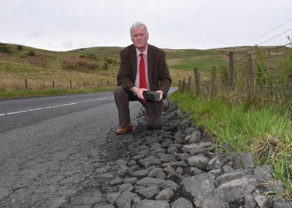 Hawick councillor Davie Paterson surveying the state of the B6399 to Newcastleton from Hawick.