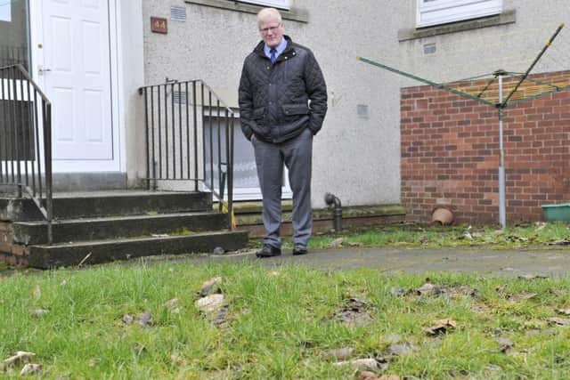 Hawick councillor Stuart Marshall investigating complaints about dog-fouling in the Wellfield area of Hawick.