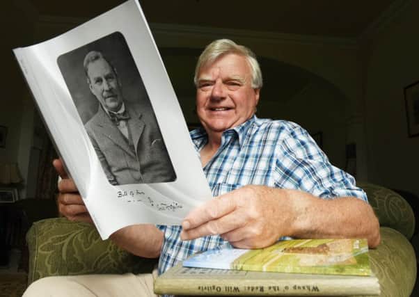Philip Murray at home near Hawick with a book about local poet Will Henry Ogilvie.