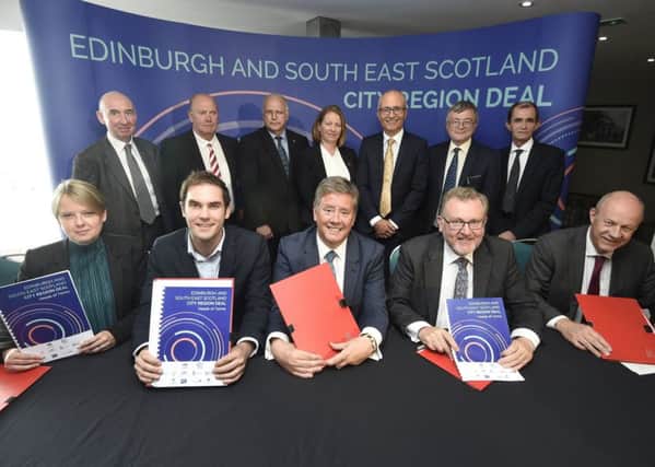 Scottish Borders Council leader Shona Haslam, front left, and Borders MP David Mundell, three places to her right, at the signing of the deal.
