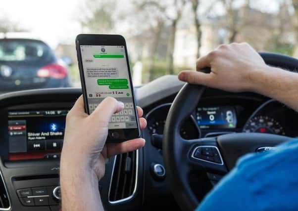 Drivers still admit to taking risks by calling and texting while driving, although the number has fallen since new legislation introduced earlier this year.