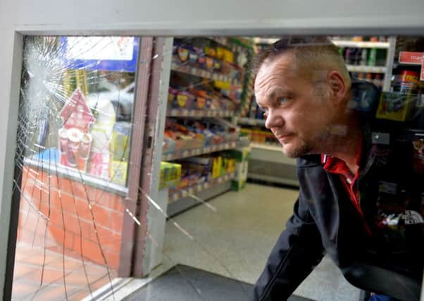 Richard Garrie surveying the damage done at Tweed Road Stores in Galashiels.