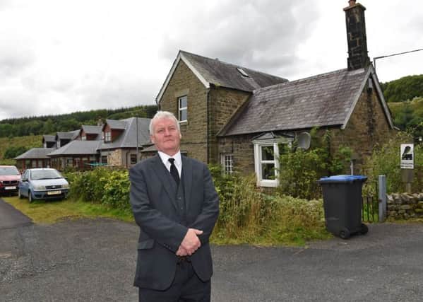 Hawick councillor Davie Paterson outside the old stationmaster's house in Newcastleton.