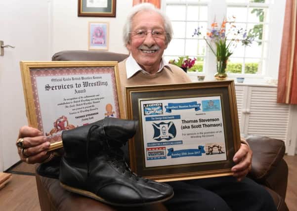 Ex-wrestler Tommy Stevenson with his old wrestling boots reflects on his career in the sport.