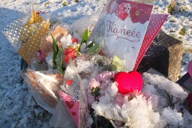 Floral tributes left beside the A698 for Kirsty Parker.