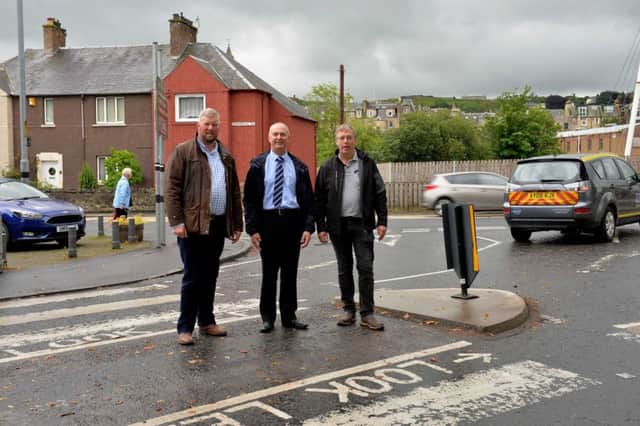 L-R are NIEL RICHARDS (COUNCILLER) IAN TURNBULL (CHAIR,HAWICK COMMUNITY COUNCIL) and STUART BECK