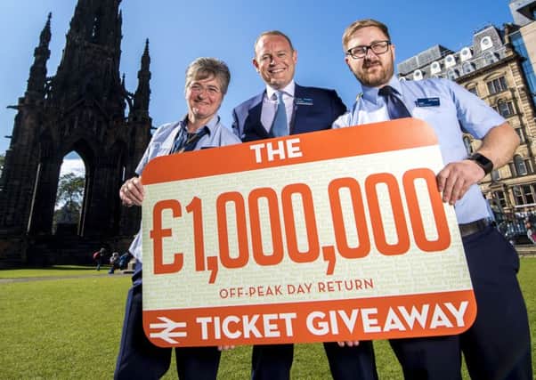 ScotRail Alliance managing director Alex Hynes promotes the Million Pound Giveaway with team members from Edinburgh Waverley.