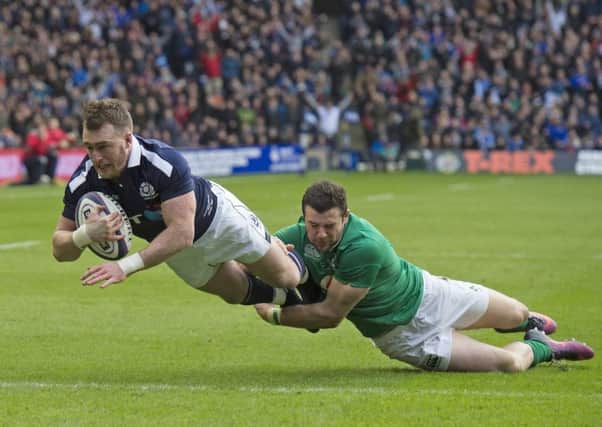 Stuart Hogg scores a try against Ireland, with Robbie Henshaw in tow (picture by Neil Hanna Photography).