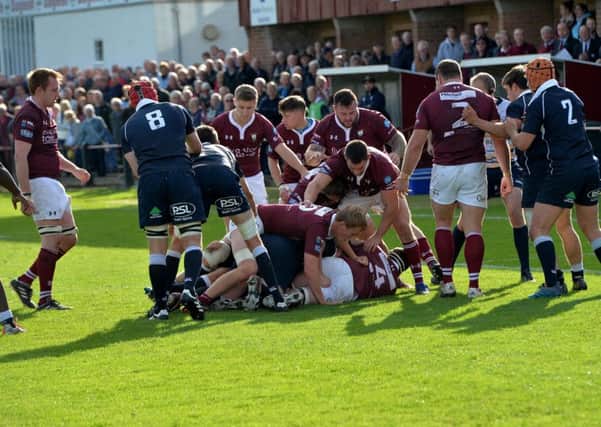 A tangled mass of bodies illustrates how close the game was between Gala and Selkirk, in blue (picture by Alwyn Johnston).