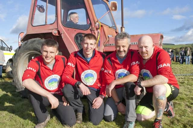 Borders Search and Rescue team mates Alistair McDonald, Scott Thompson, Arran Smith and Bob McKeans compete in the tractor pull.
