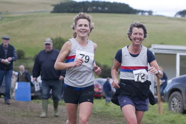 Norham runners Hanna Humphreys and Caroline Tyser during Yetholm's hill run