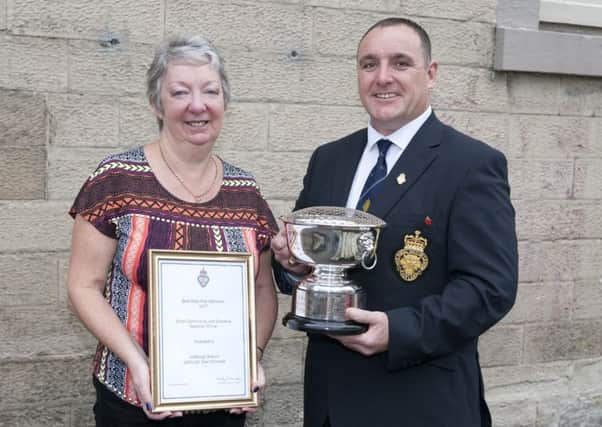 Jedburgh RBL's Heather Smith and Shaun Carroll with the award for the town's war memorial.