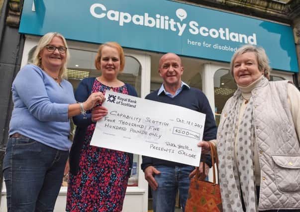 Susan Forster, far right, with, from left, committee member Claire Mactaggart, Donna Mackie of Capability Scotland and fundraiser David Mactaggart.