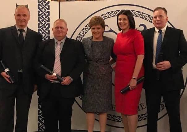 Kevin Douglass, Mark Neil, Susan Blake and Robert Anderson are rewarded by the First Minister for their efforts in saving a newborn baby, at the Brave@heart Awards ceremony in Edinburgh on Tuesday evening.