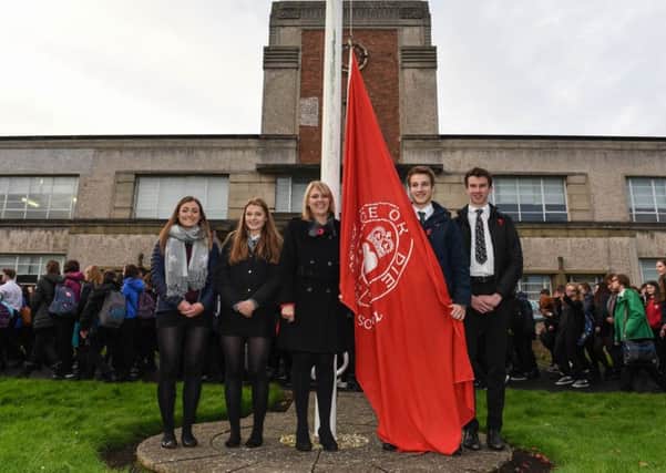 The last day of the old Kelso High School saw the flag being lowered for the last time in a small ceremony. L-r Deputy Head Girl Grace Edwards, Head Girl Aimee Martin, Headteacher Jill Lothian, Head Boy Charlie Graves and Deputy Head Boy James Crombie.