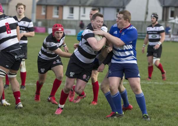 Kelso, in black and white, pictured last weekend against Howe of Fife, have been severely hit by injuries, leading to tomorrow's clash with Melrose being called off (picture by Gavin Horsburgh)