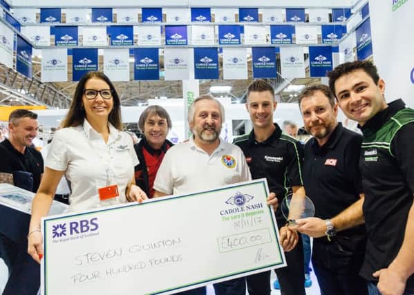 Rebecca Donahue, Head of Marketing at Carole Nash and Shaun Colin from Motorcycle News present Biking Heroes runner up, Hawick's Steven Quintus, with a cheque for Â£400, alongside Carole Nash ambassadors, Jonathan Rea, Leon Haslam and Ron Haslam.