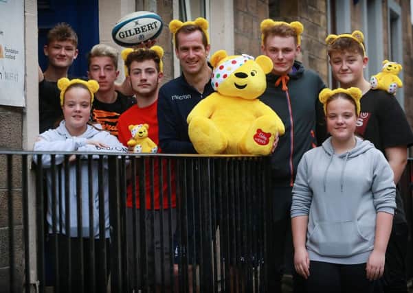 Children in Need's Pudsey Brear and former Scotland rugby player Chris Paterson meet children from TD1 Youth Hub in Galashiels.