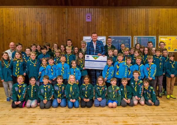 Doddie Weir being given a cheque for Â£3,000-plus by Lauderdale Scout Group.