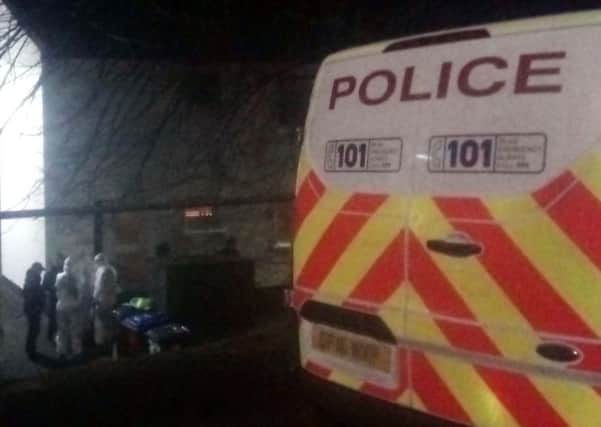 Police in protective clothing searched a house in Hawthorn Road, Galashiels, on Monday night