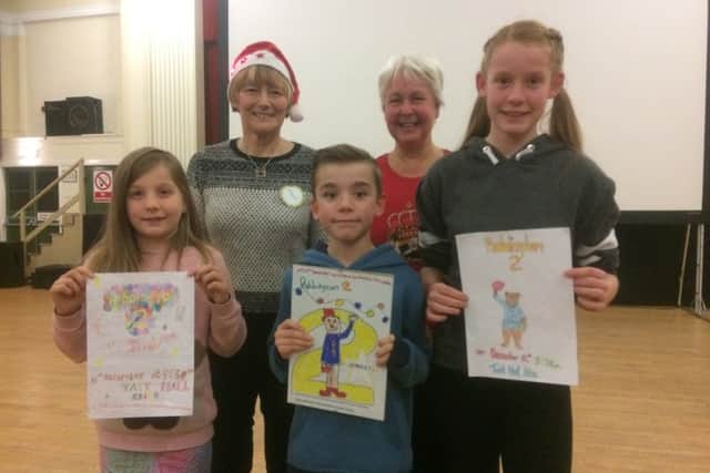 Poster competition winner  Danny McMahon with runners up Becky McMahon and Hannah Ducker, with Verity Mutch and Eleanor Wood from Kelso Community Cinema.