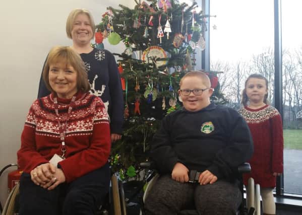 Langlee teacher Marion Romeril retired on Thursday after 33 years at the school. She's joined in the picture by her former pupil, now an additional needs assistant at the school, Anne Bain, oldest P7 pupil Danny Lindores and youngest primary 1 pupil Sofia Bazilevica.