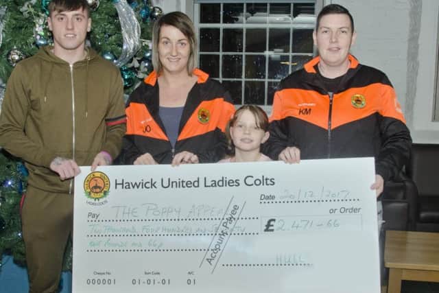 Hawick United Ladies Colts hand over cheque to Robbie Shields. Pictured with him are Kelly Moffat, Myley Moffat and Jane O'Rourke. Photo: Derek Lunn.