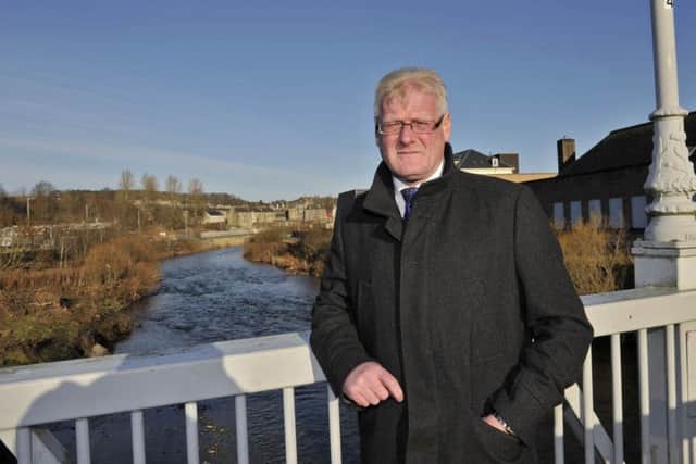 Councillor Stuart Marshall looking over the River Teviot.