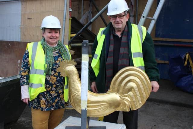 Scottish Borders Councillor Elaine Thornton-Nicol and community councillor Tommy Combe inspect the weather vane