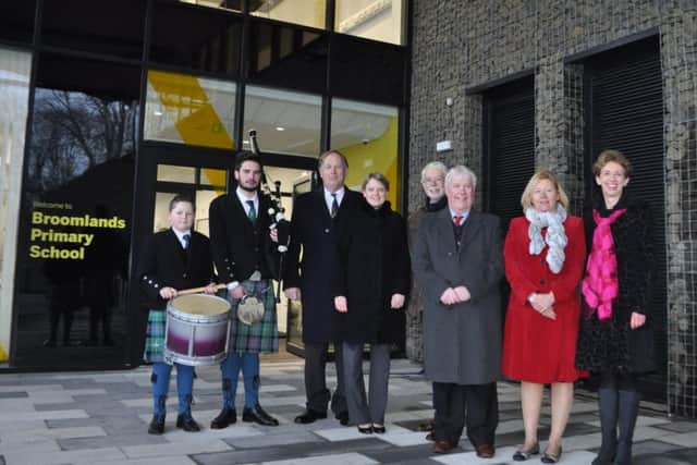 From left, pupil Mason Blackwood, old boy Angus Hislop, councillors Euan Robson, Shona Haslam, Simon Mountford and Tom Weatherston, headteacher Michelle Matthews and portfolio holder Carol Hamilton at the opening of the new Broomlands Primary School in Kelso.