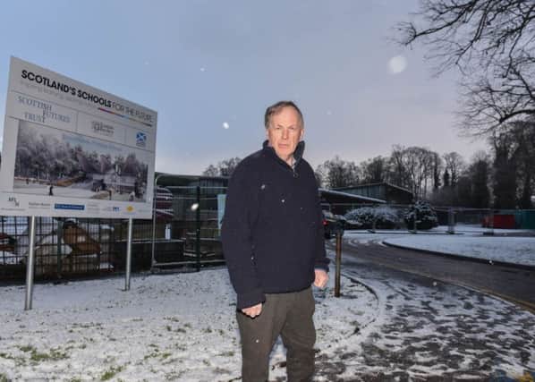 Kelso councillor Euan Robson near the new Broomlands Primary School. Euan is standing outside the entrance to the old school where he proposes more parking space in order to stop cars parking outside the new school on a narrow piece of road.