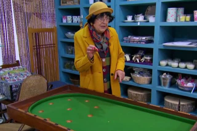 Anita blows her entire kitty on a bagatelle table in Old Melrose.