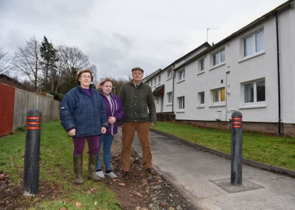Gill Usher, Adi McAuley and Stuart Usher at The Linn in Kelso where bollards have been put at the end of their path.