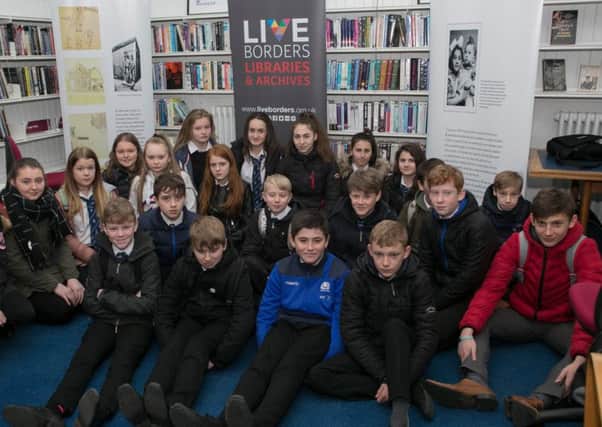 Hawick schoolchildren at a Holocaust memorial event held at Hawick Library.