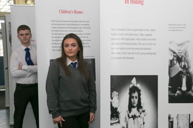 Jedburgh Grammar School students Alexander Edwards and Lauren Reilly at a Holocaust memorial event held at Hawick Library.
