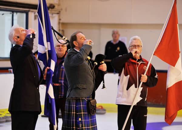 A toast at the Kelso curling rink to Scottish-Canadian sporting links. Wonder if they had ice in their drinks? (picture by Stuart Cobley).