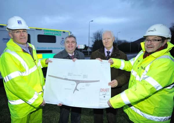 Frrom left, Transport Scotland road safety manager Derek Williamson, Scottish Borders Council convener David Parker, NHS Borders chairman John Raine and Amey strategic road safety manager Jim Reid beside the A6091 with plans for the new junction.