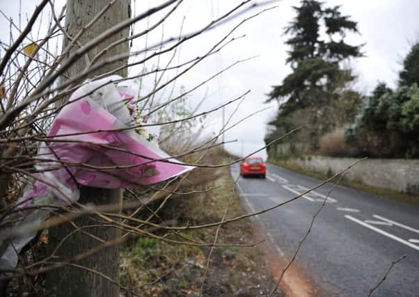 Flowers left alongside the A698 in 2016 as a tribute to Leon Ali.